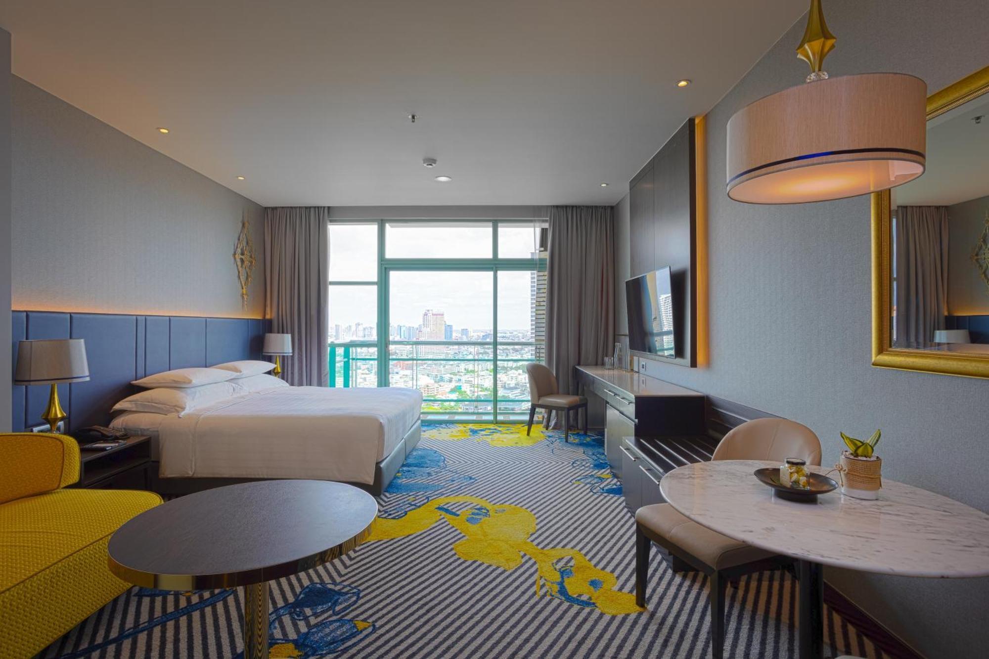 Grand Deluxe Club met een Kingsize Bed en Uitzicht op de Rivier