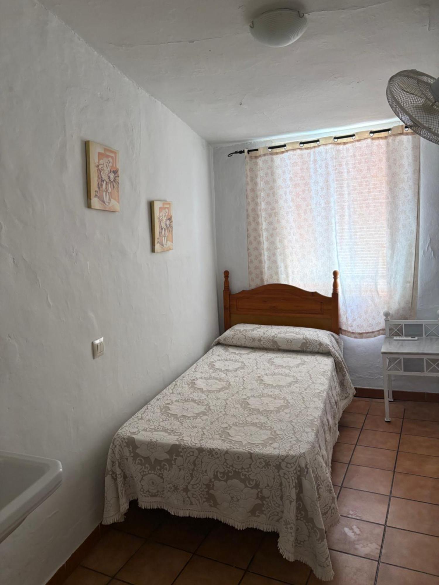 Habitación individual con aseo compartido