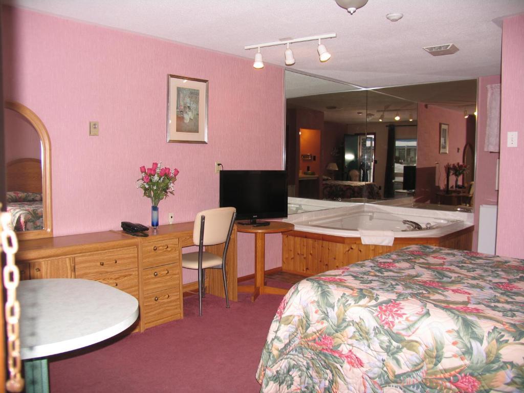 Quarto com Cama Queen-size e Banheira de Hidromassagem